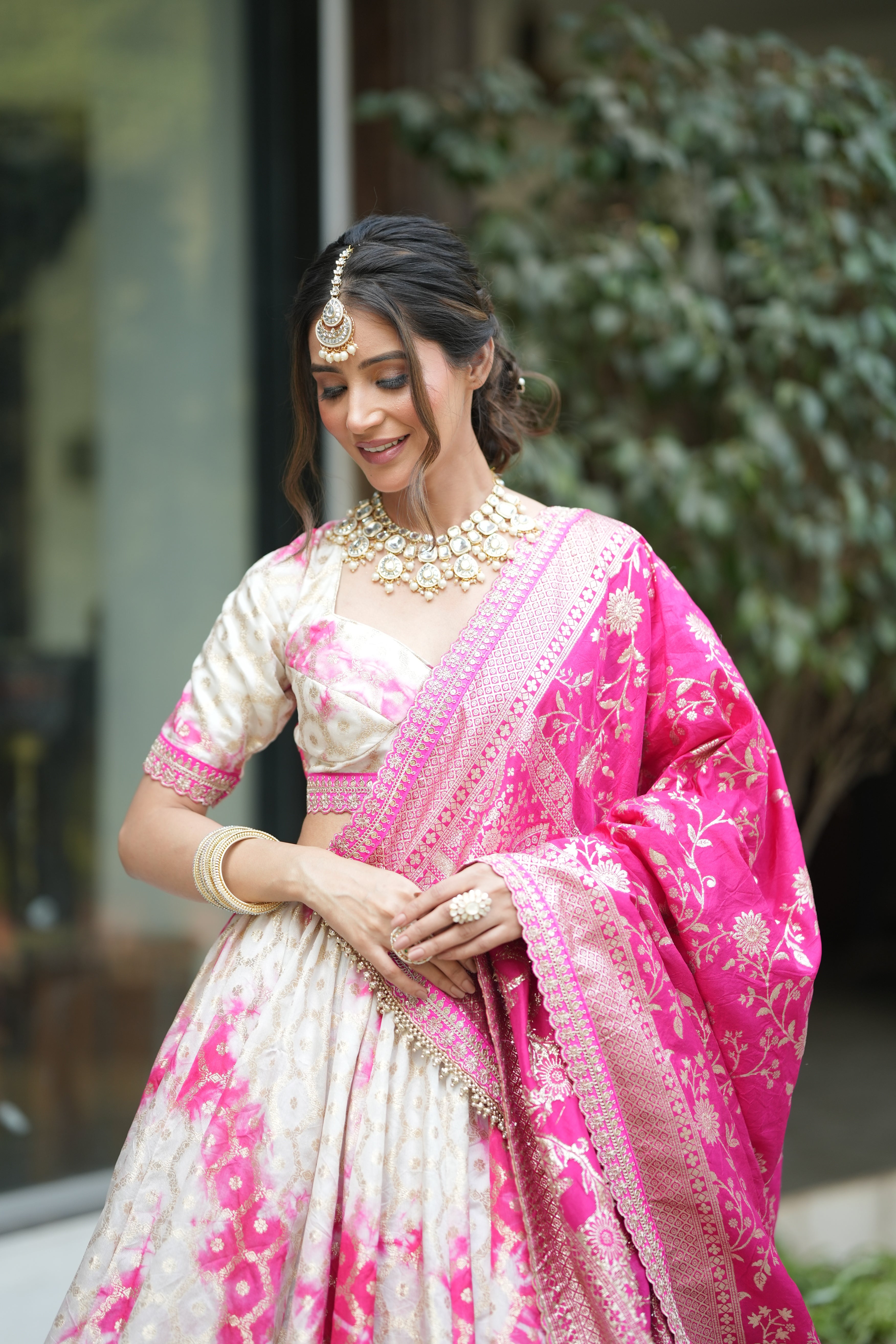 Banarasi silk bridal lehenga with pure Banarasi dupatta draped over shoulder – traditional wedding wear look for women.