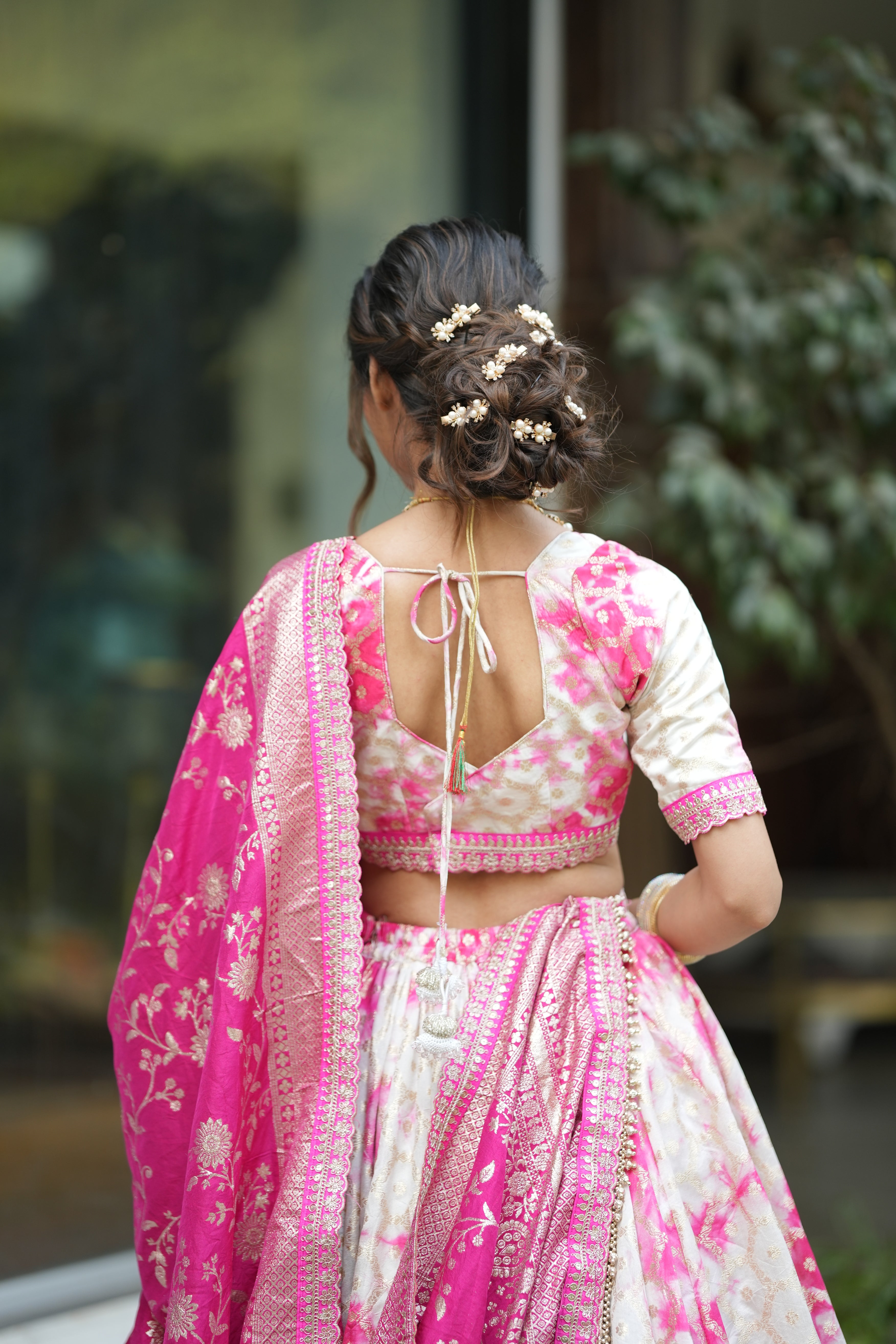 Banarasi lehenga blouse with zari detailing and adjustable dori – elegant fit for wedding and bridal occasions.