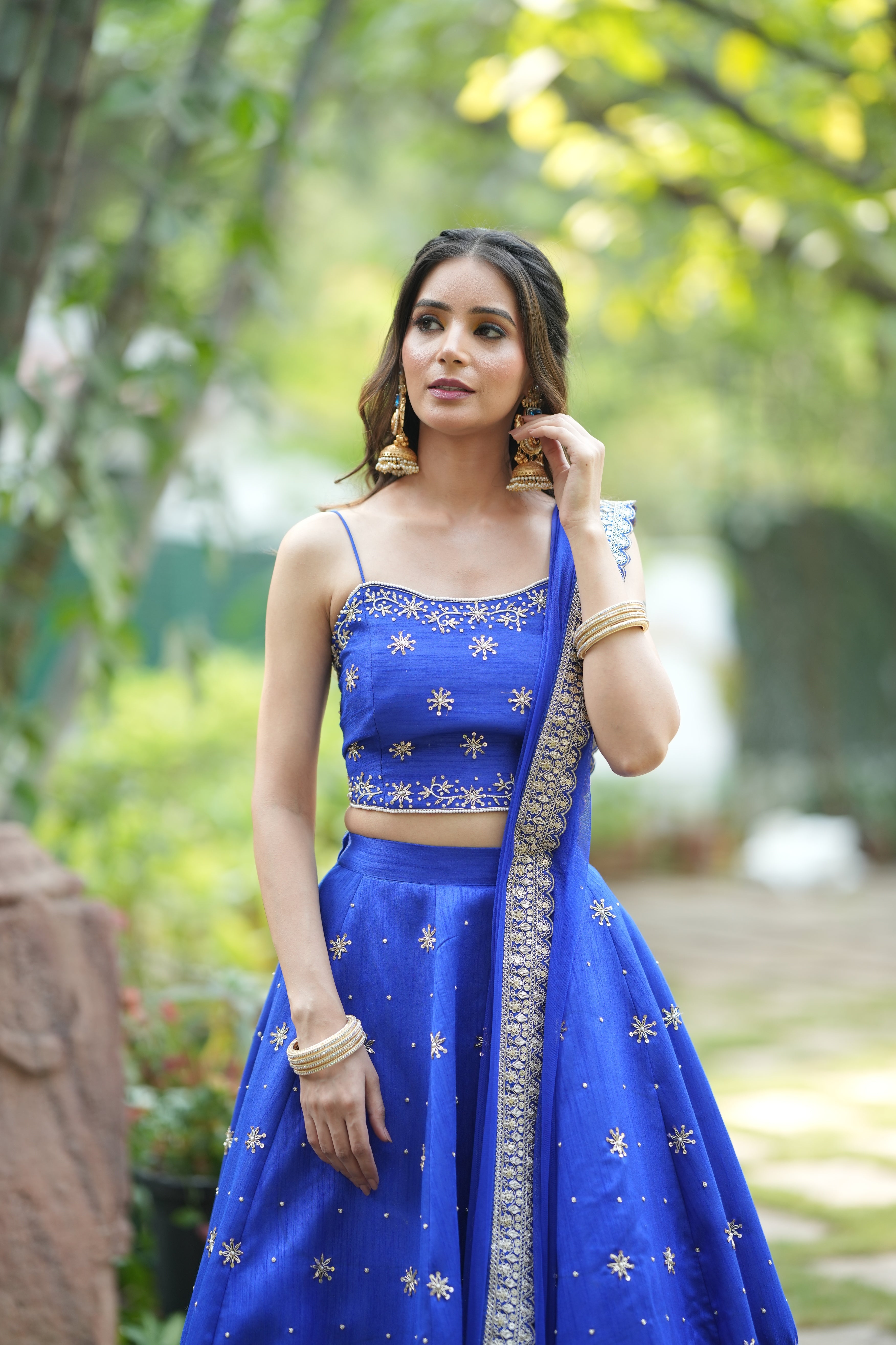 Blue lehenga set with stylish designer crop top blouse and intricate embroidery
