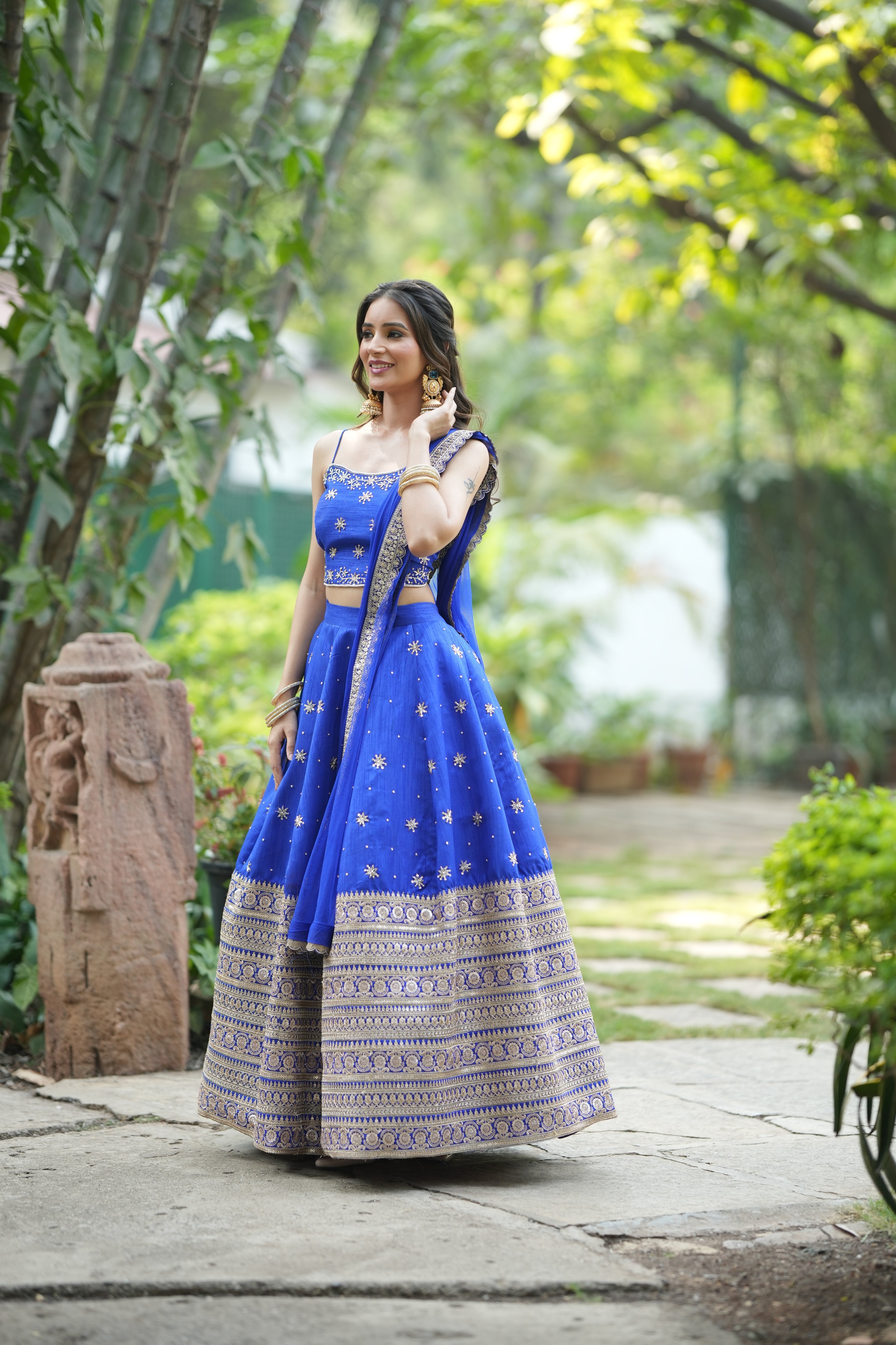 Blue lehenga set with stylish designer crop top blouse and intricate embroidery