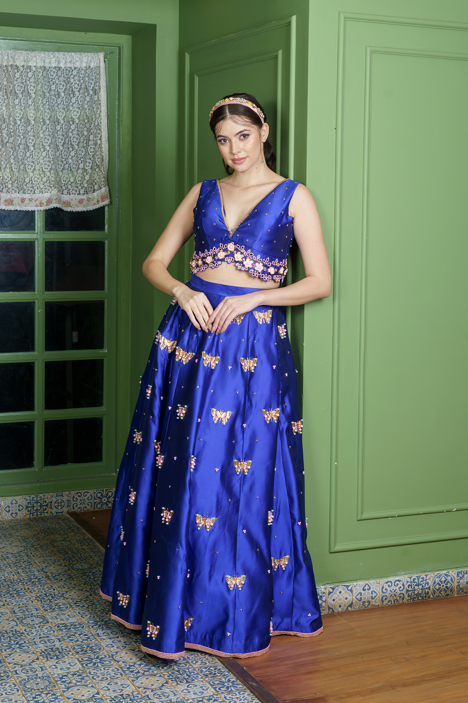 Deep V-neck embroidered blouse paired with bridal lehenga for women