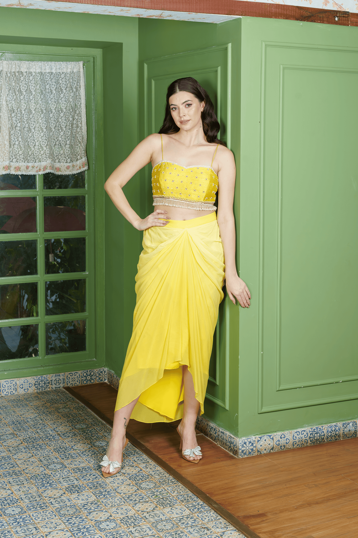 Woman wearing citrus drape dhoti set with crop top in citrus yellow