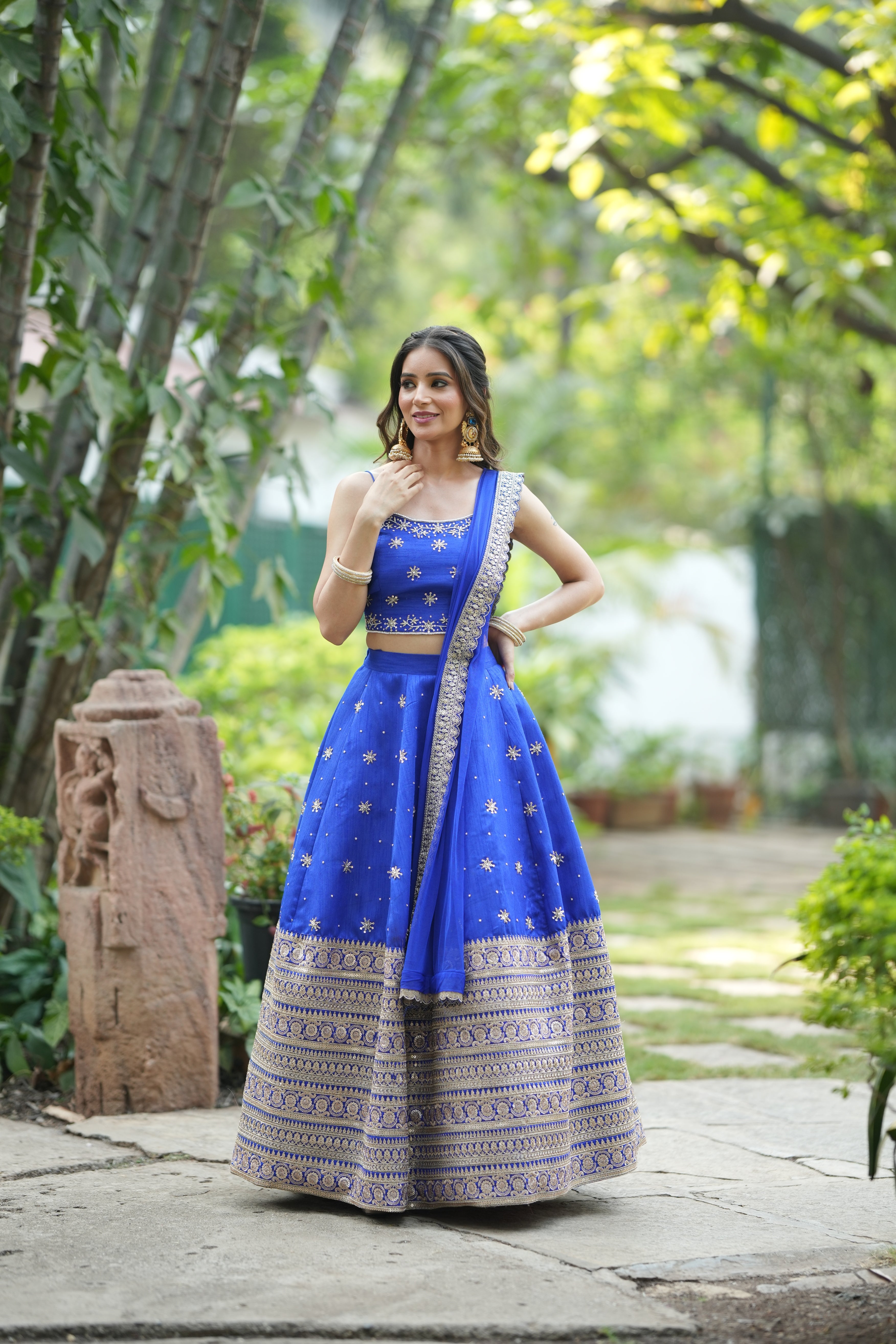 Crop top blouse paired with blue wedding lehenga for women