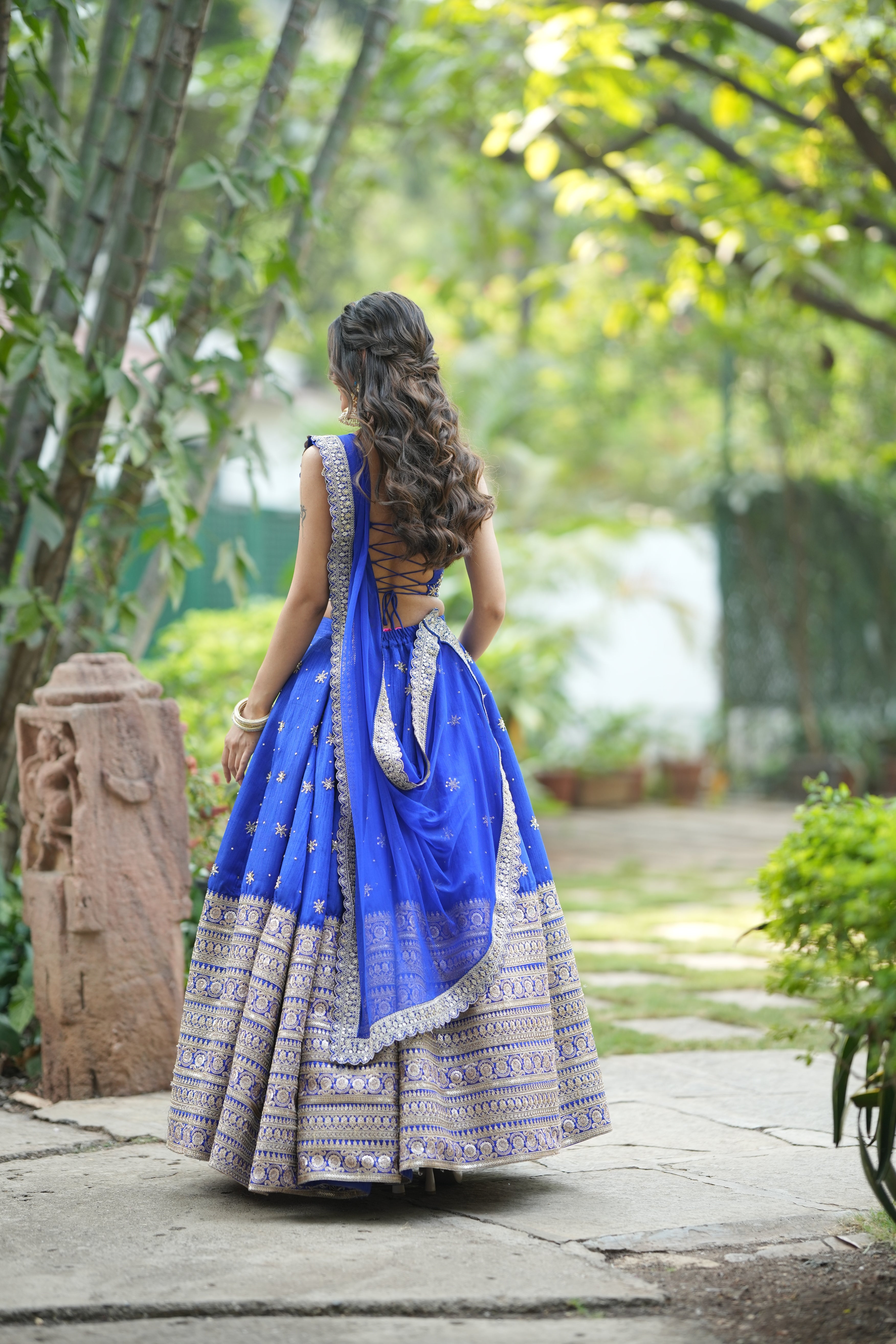 Crop top blouse paired with blue wedding lehenga for women