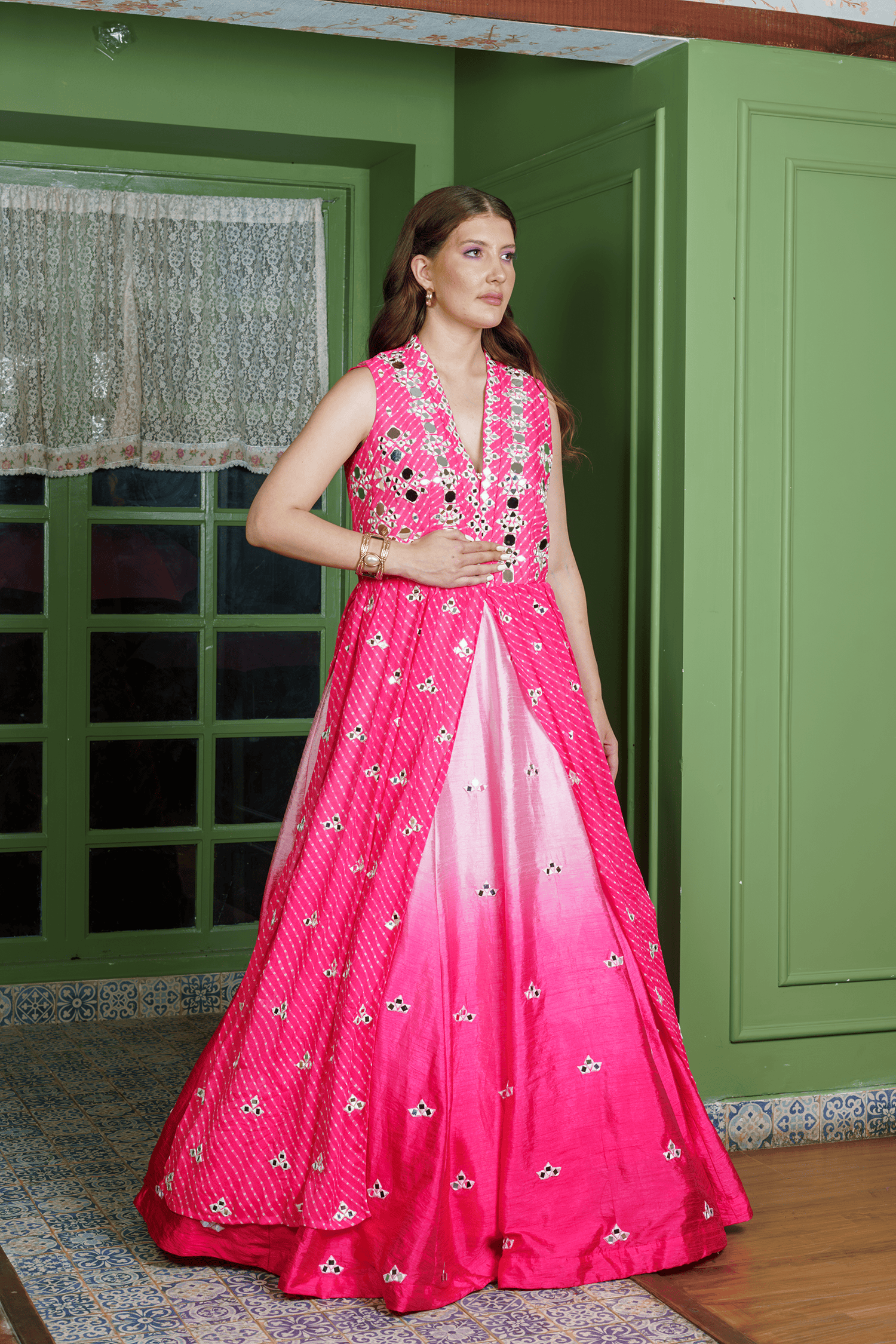 Designer red ombre lehenga with shrug and detailed mirror embroidery.