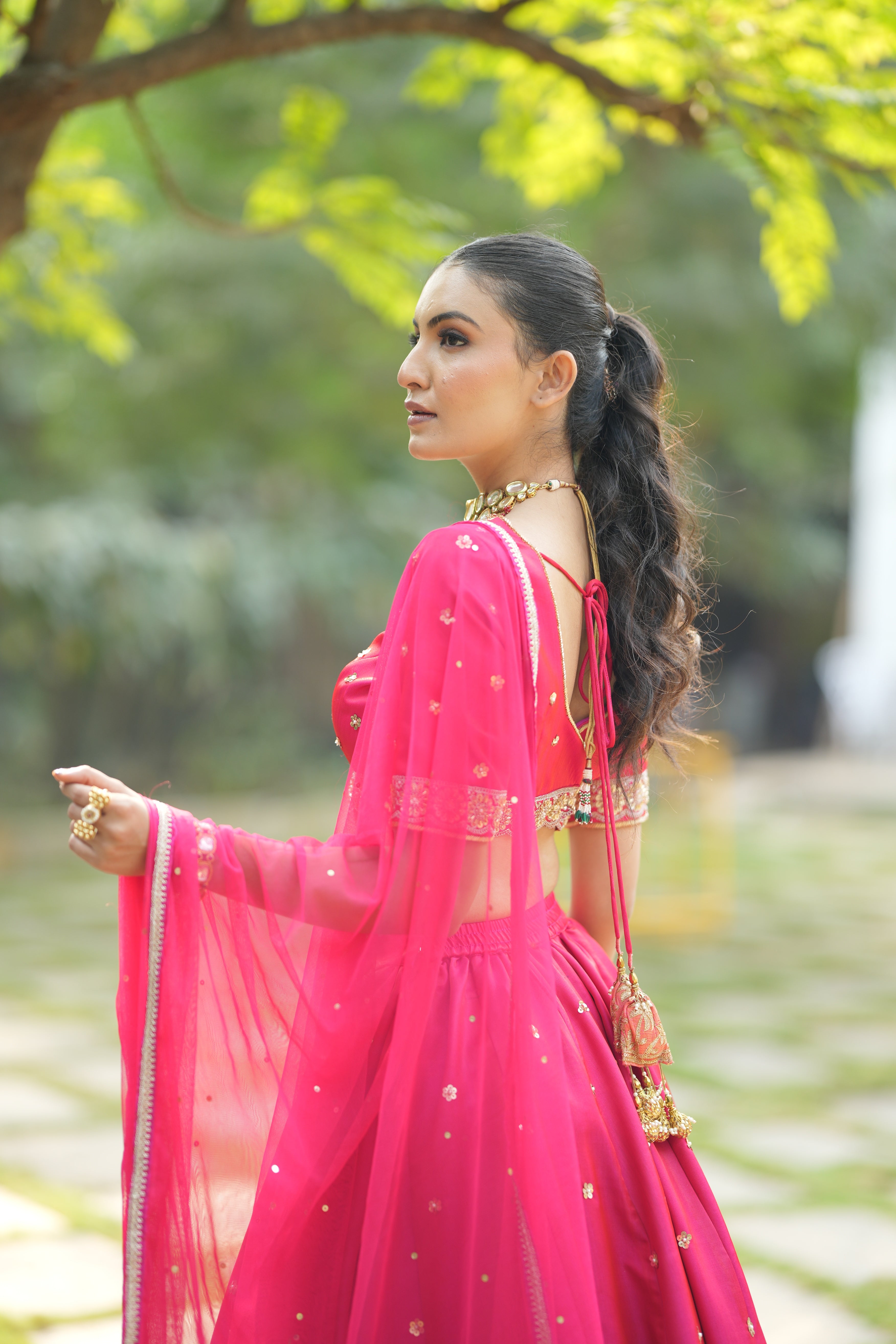 Close-up of the Designer Red Silk Bridal Lehenga, highlighting the fine craftsmanship and elegant design