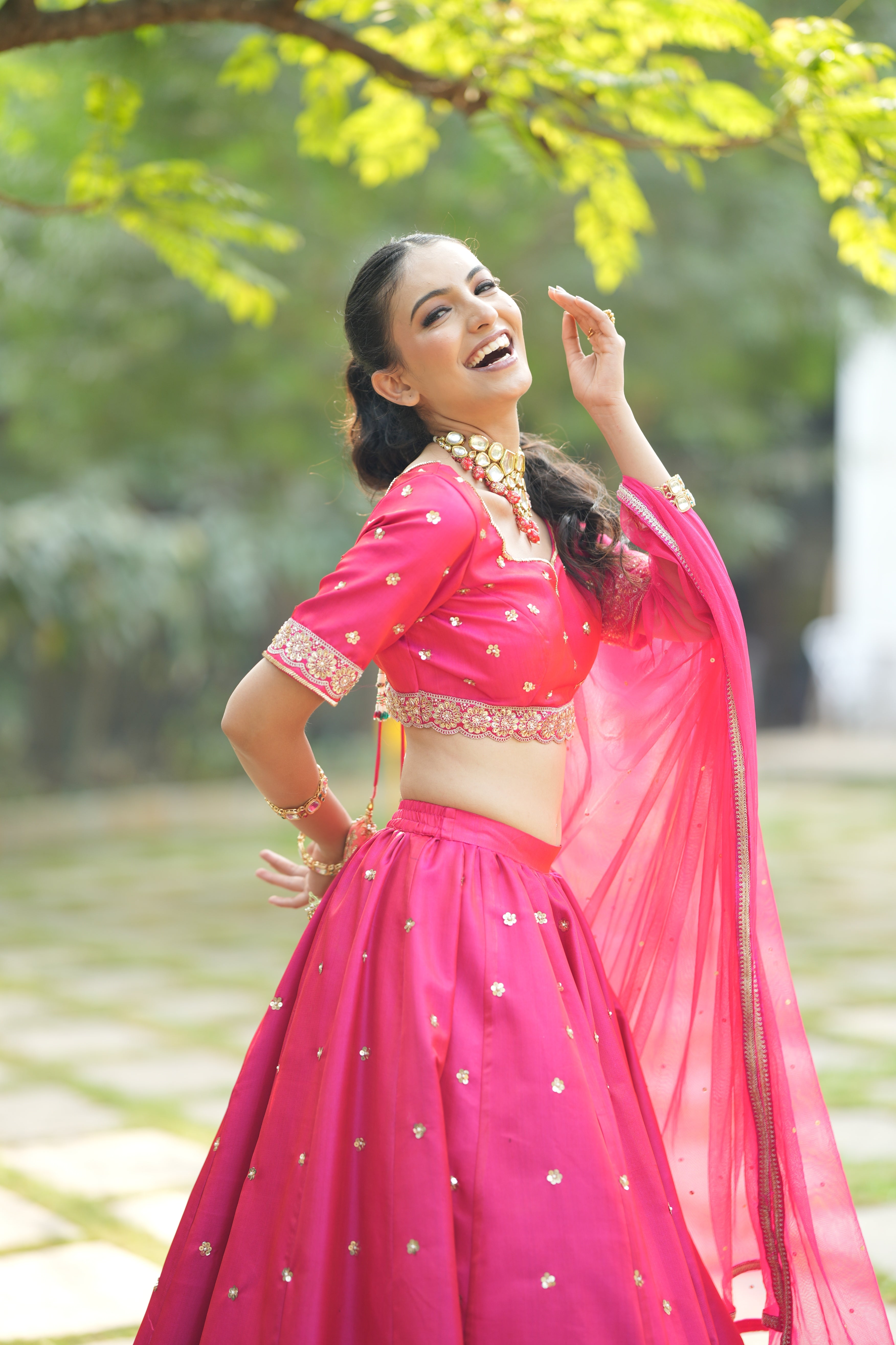 Designer Red Silk Bridal Lehenga paired with a zari-bordered dupatta, adding a touch of opulence for a complete bridal look.