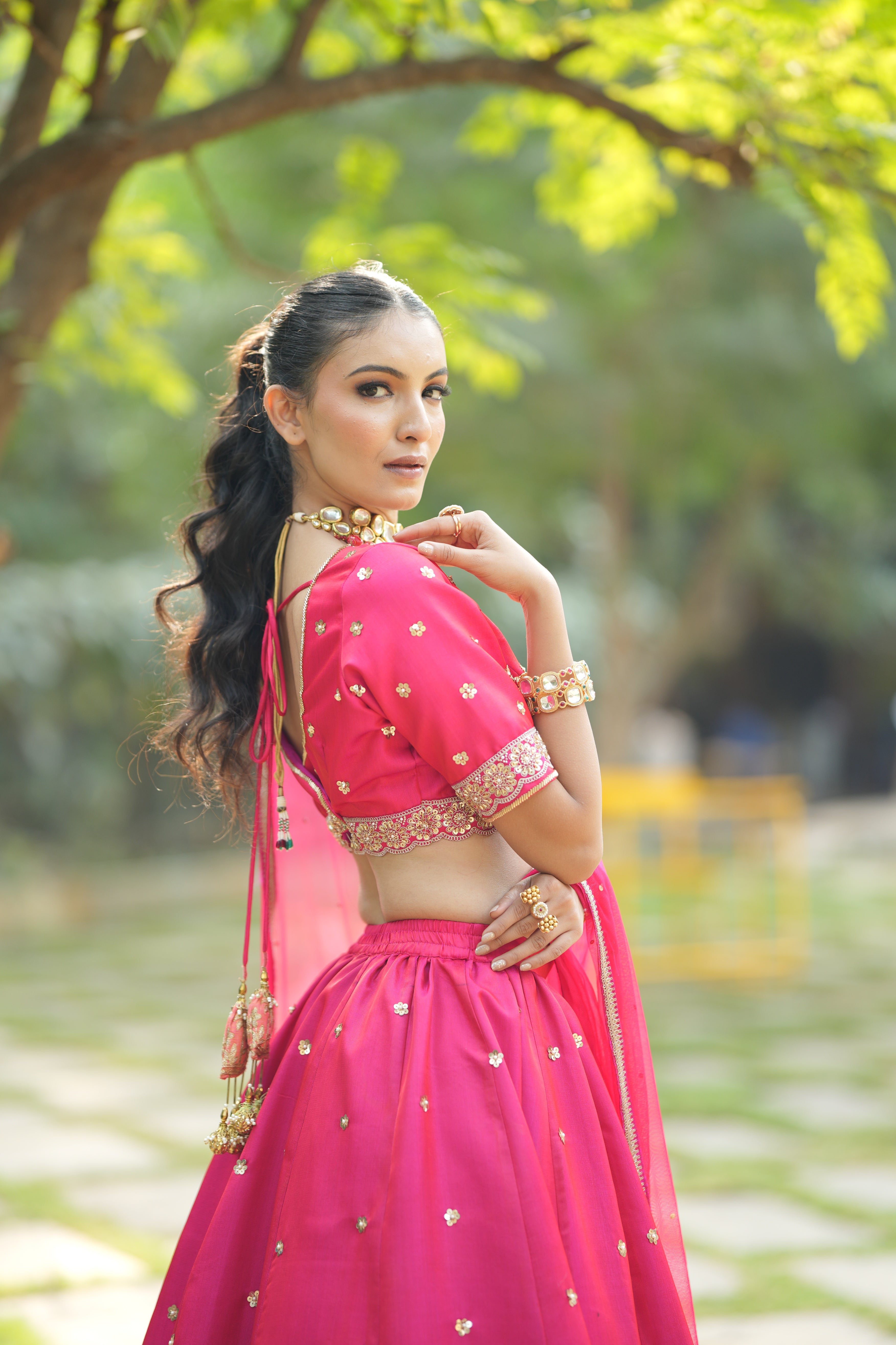 Side view of Designer Red Silk Bridal Lehenga with intricate embroidery and luxurious silk fabric, perfect for brides on their wedding day.