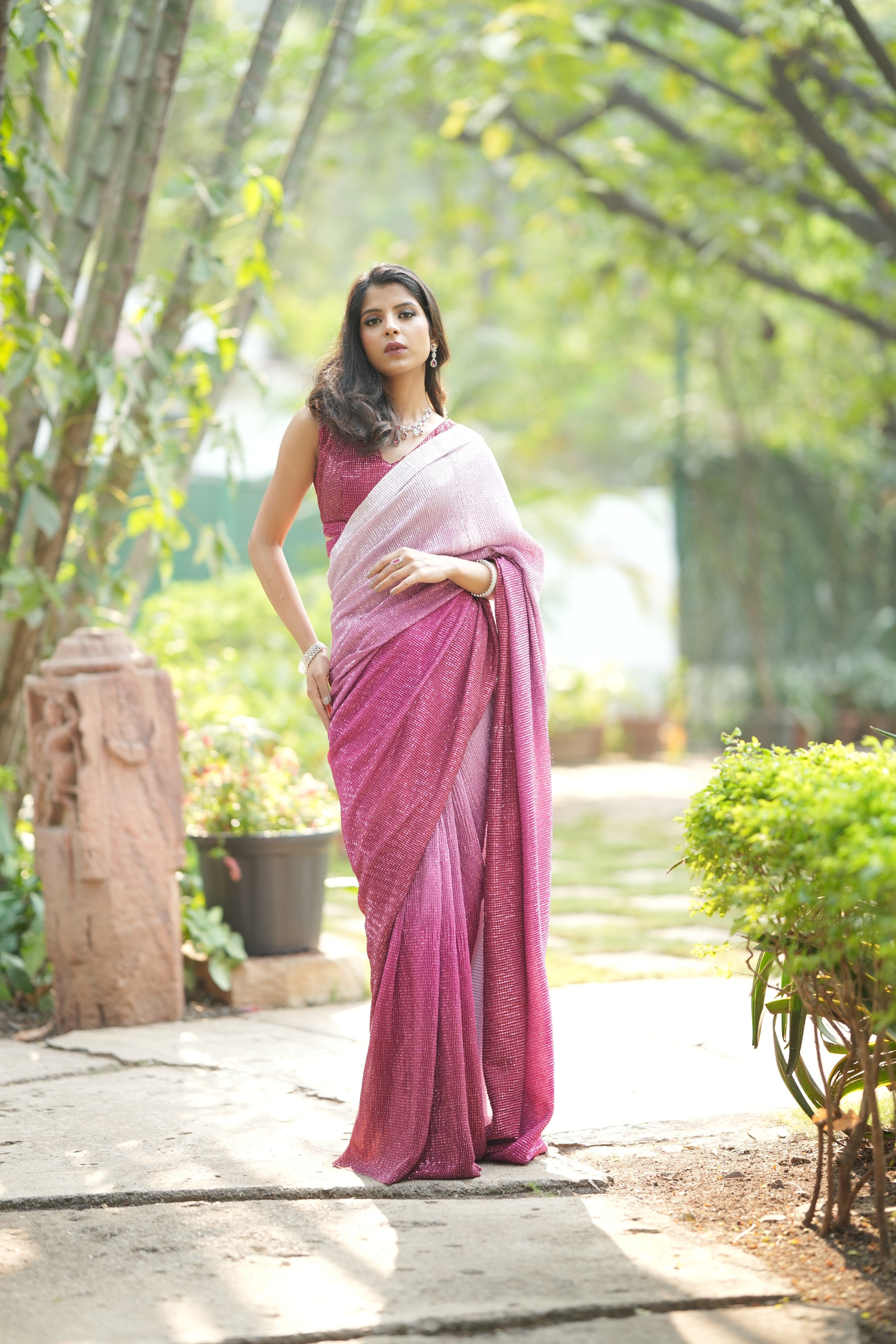 Ombre pink designer sequin saree with flowing georgette fabric, styled for a modern party look.