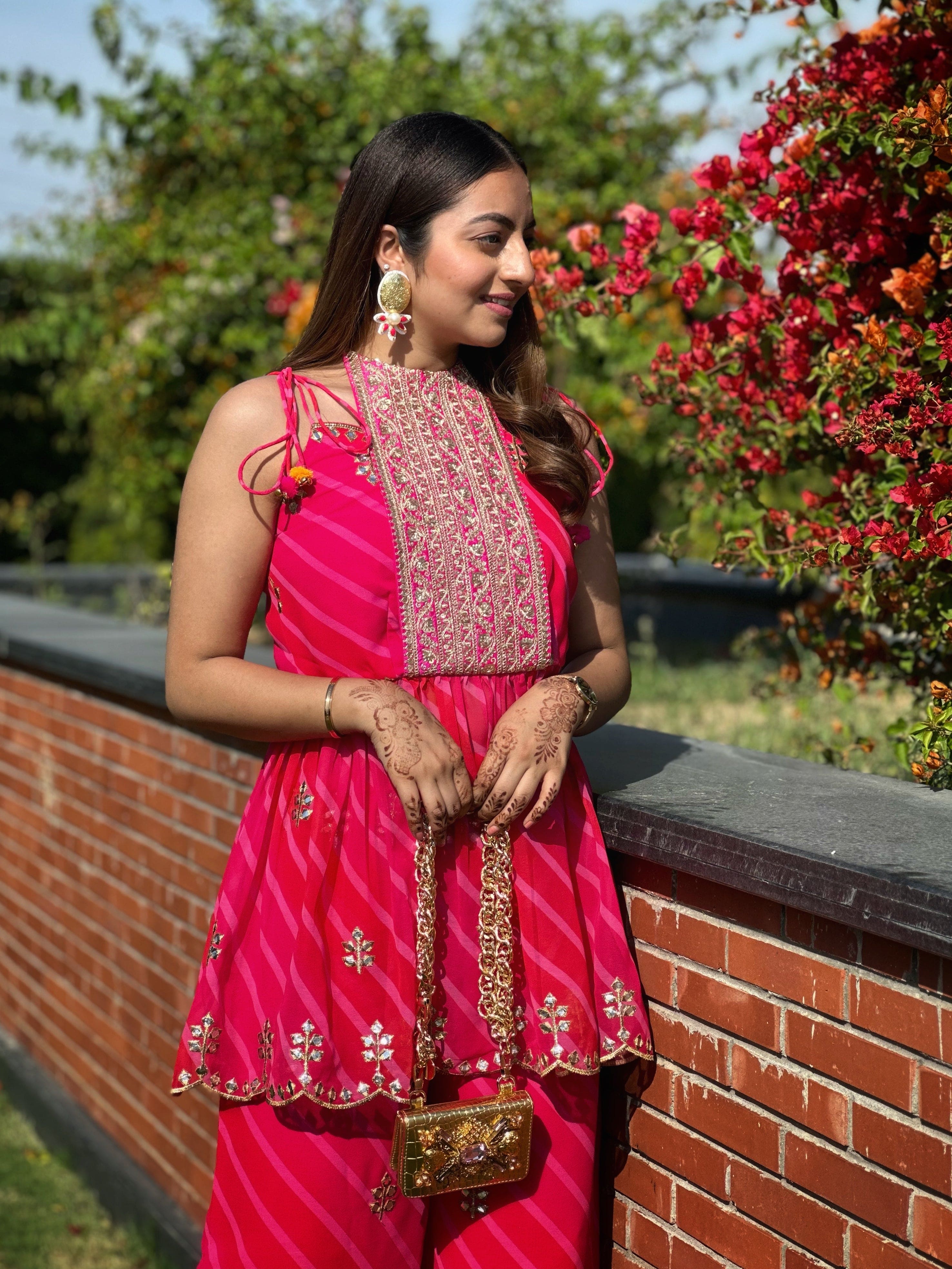 Embroidered fuchsia Lehariya kurta set with detailing and sleeveless flap design