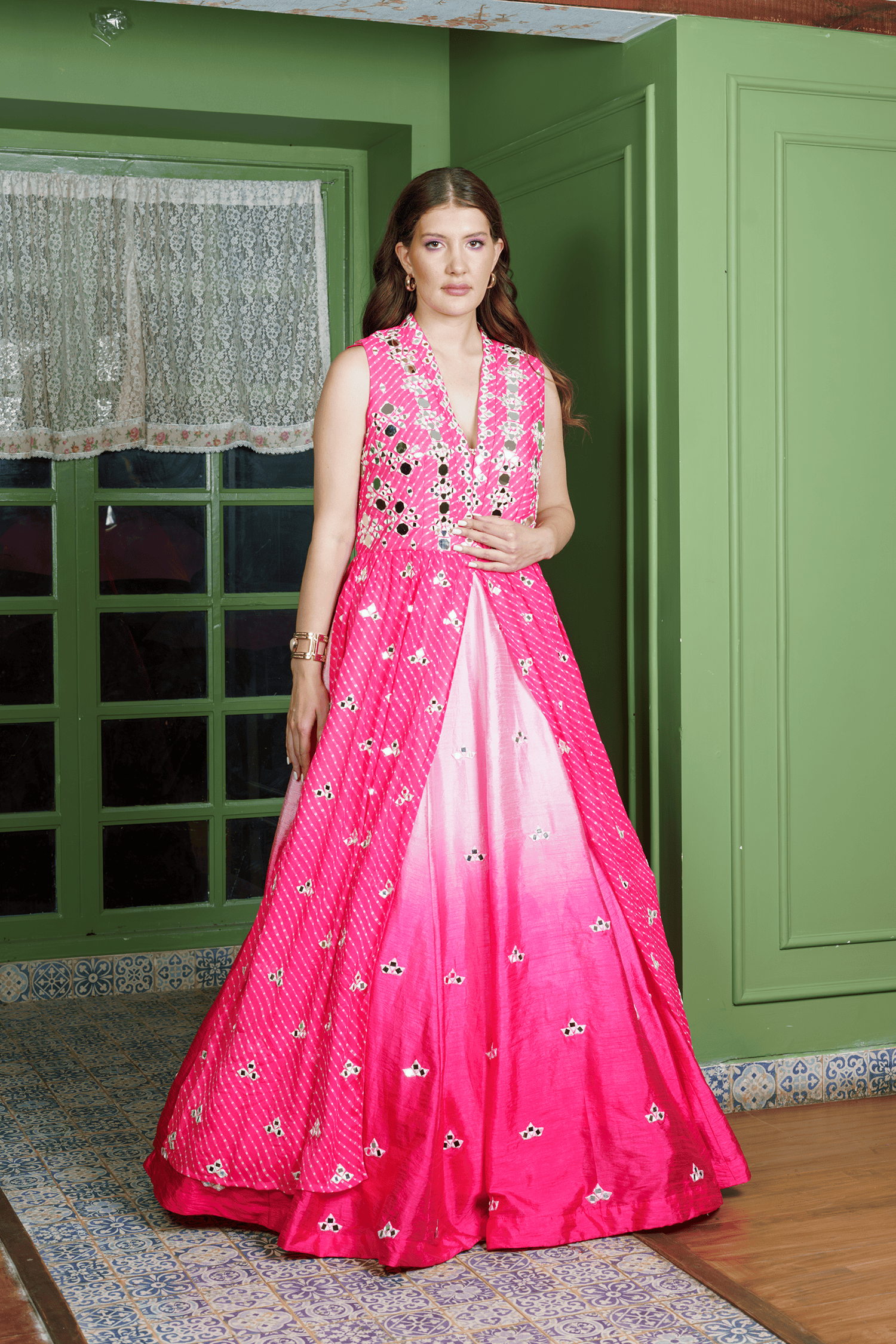 Modern lehenga with shrug showing intricate mirror embroidery and ombre color gradient.