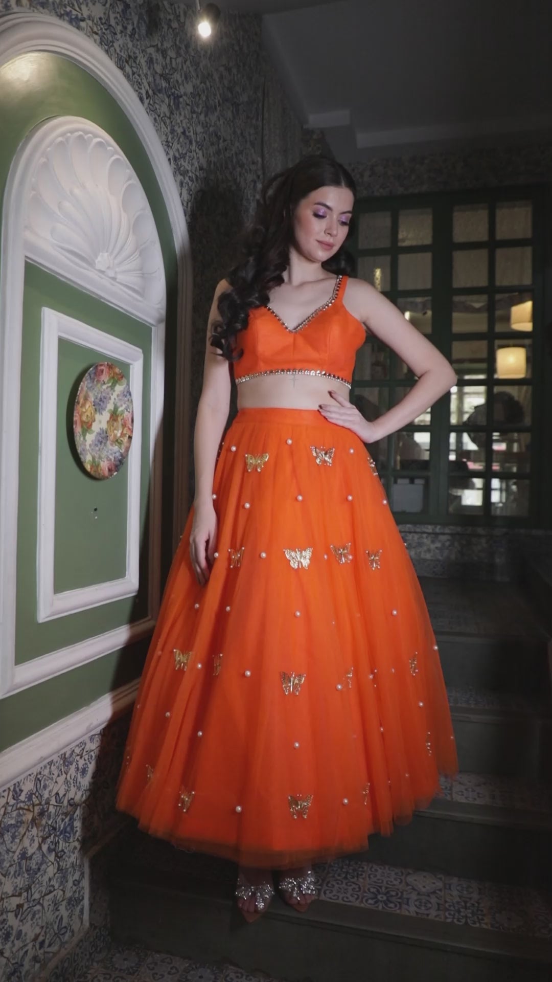 Orange lehenga crop top with mirror-trimmed straps and sweetheart neckline