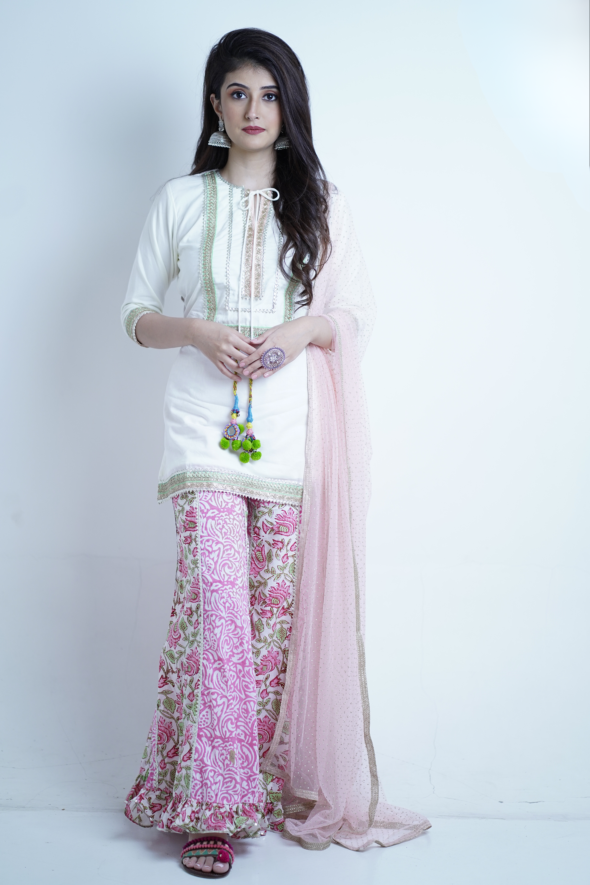 straight-cut designer white kurta with tassel accents