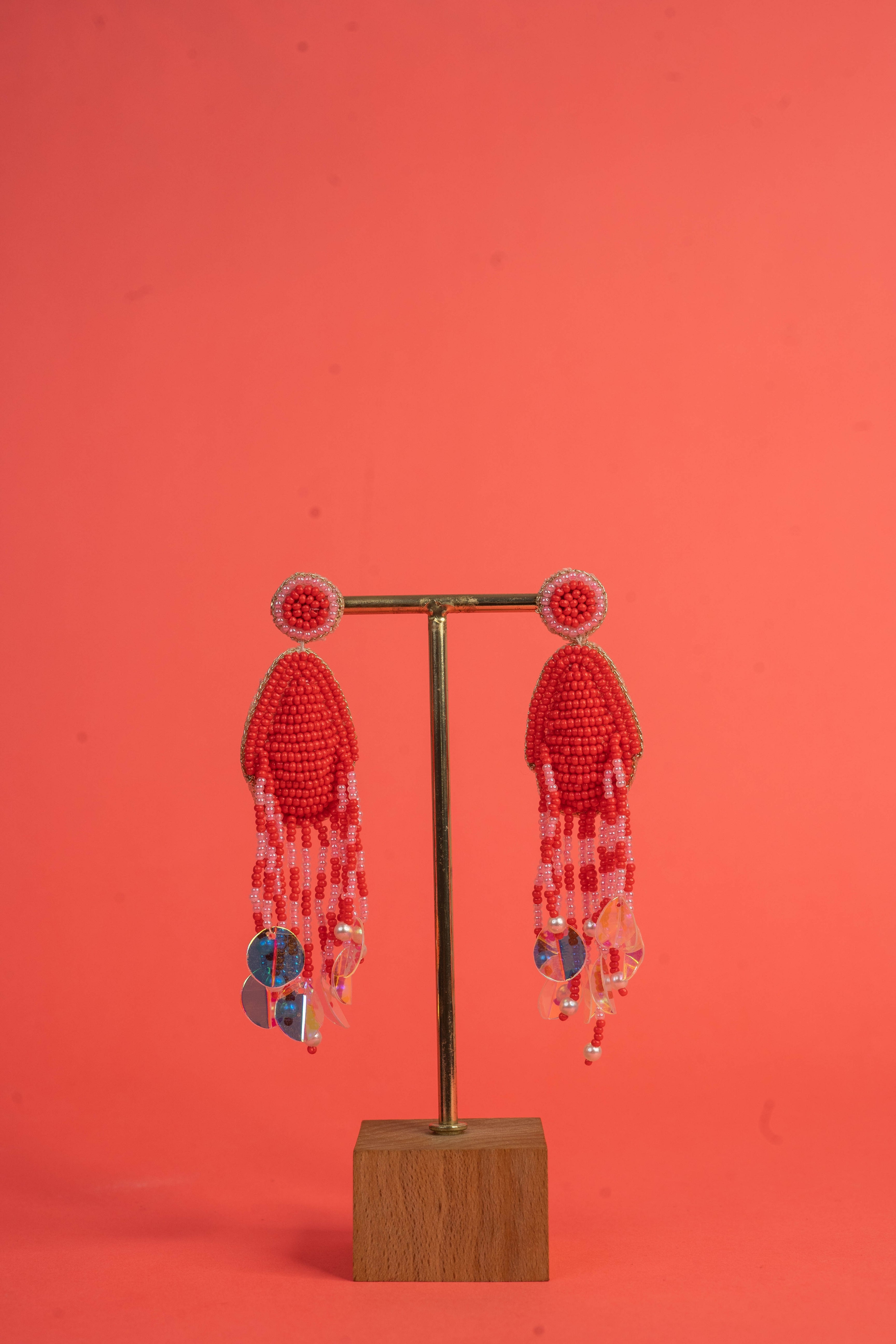 Red handcrafted beaded earrings with tassel drop