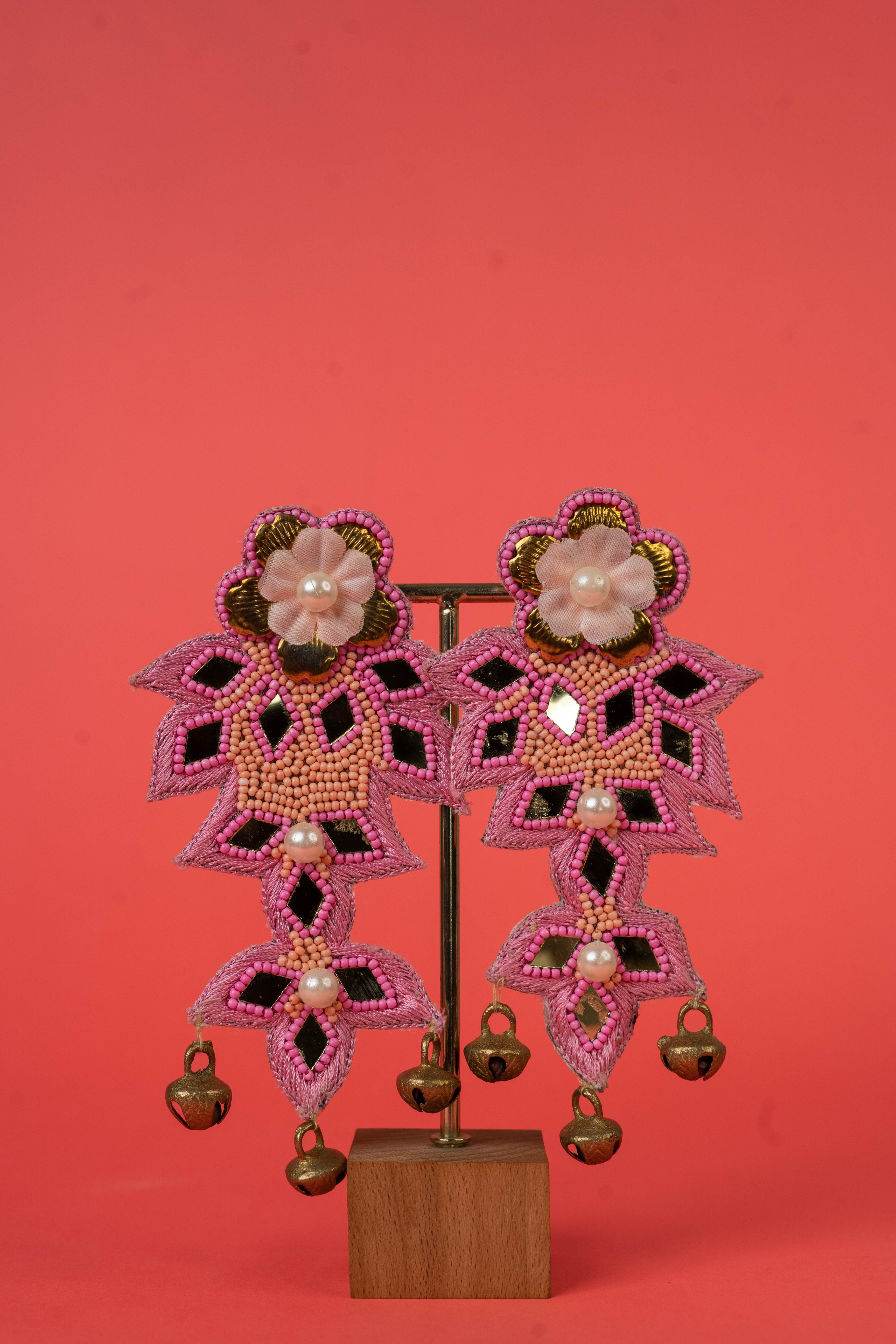 Floral pink beaded earrings with ghungroo hanging.