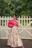 Pink off shoulder blouse with butterfly print ankle length pleated skirt .
