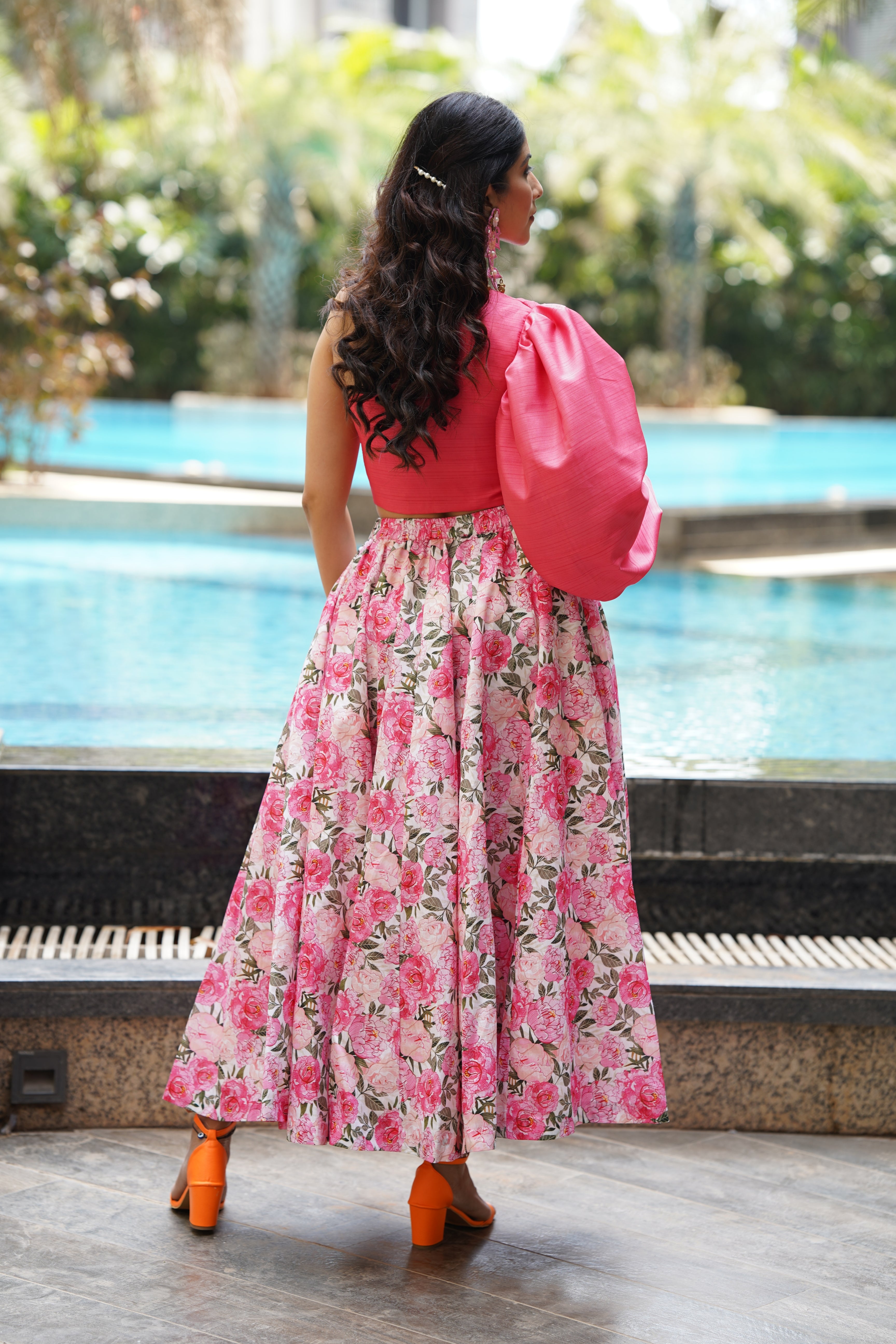 Pink off shoulder blouse with digital print floral lehenga .