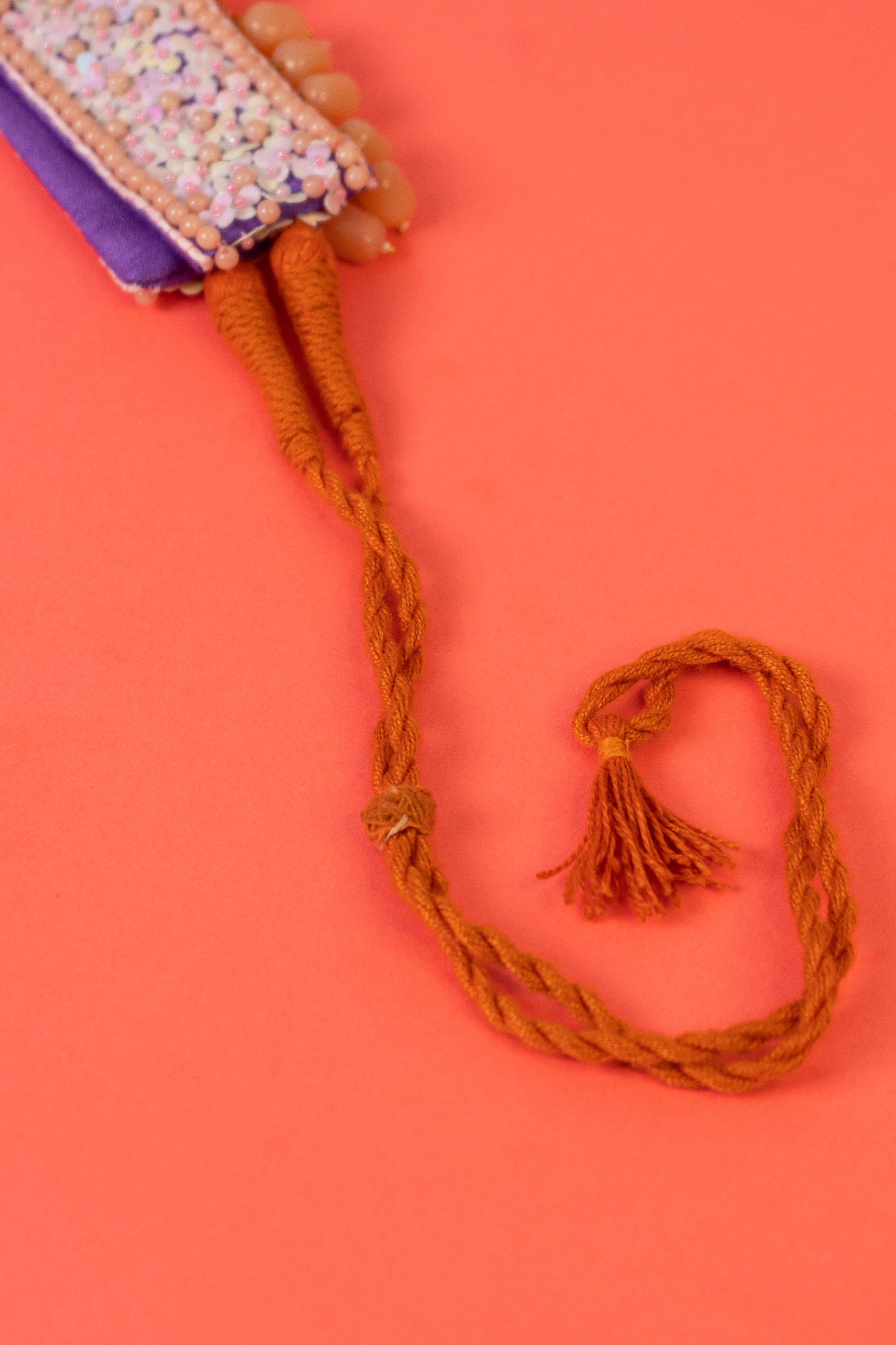 Sequins beaded choker with pearl drop .