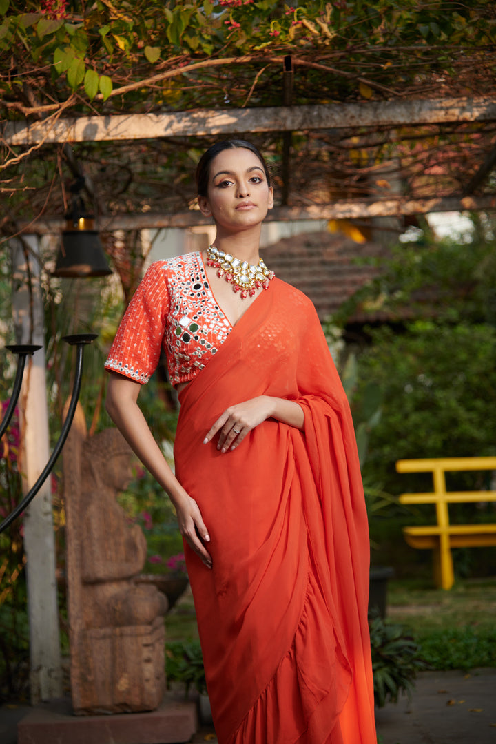 Dark orange printed blouse with ruffle saree