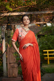 Dark orange printed blouse with ruffle saree