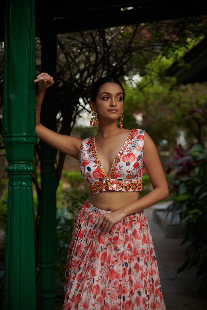 Orange floral georgette lehenga with mirror embellished blouse