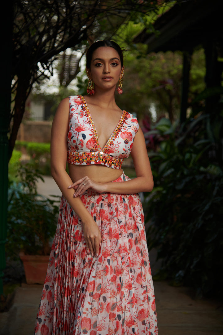 Orange floral georgette lehenga with mirror embellished blouse