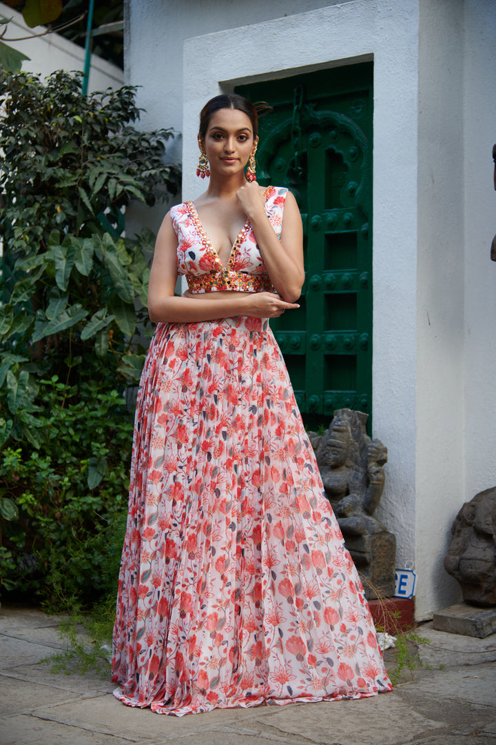 Orange floral georgette lehenga with mirror embellished blouse