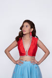 Red plunging neck blouse