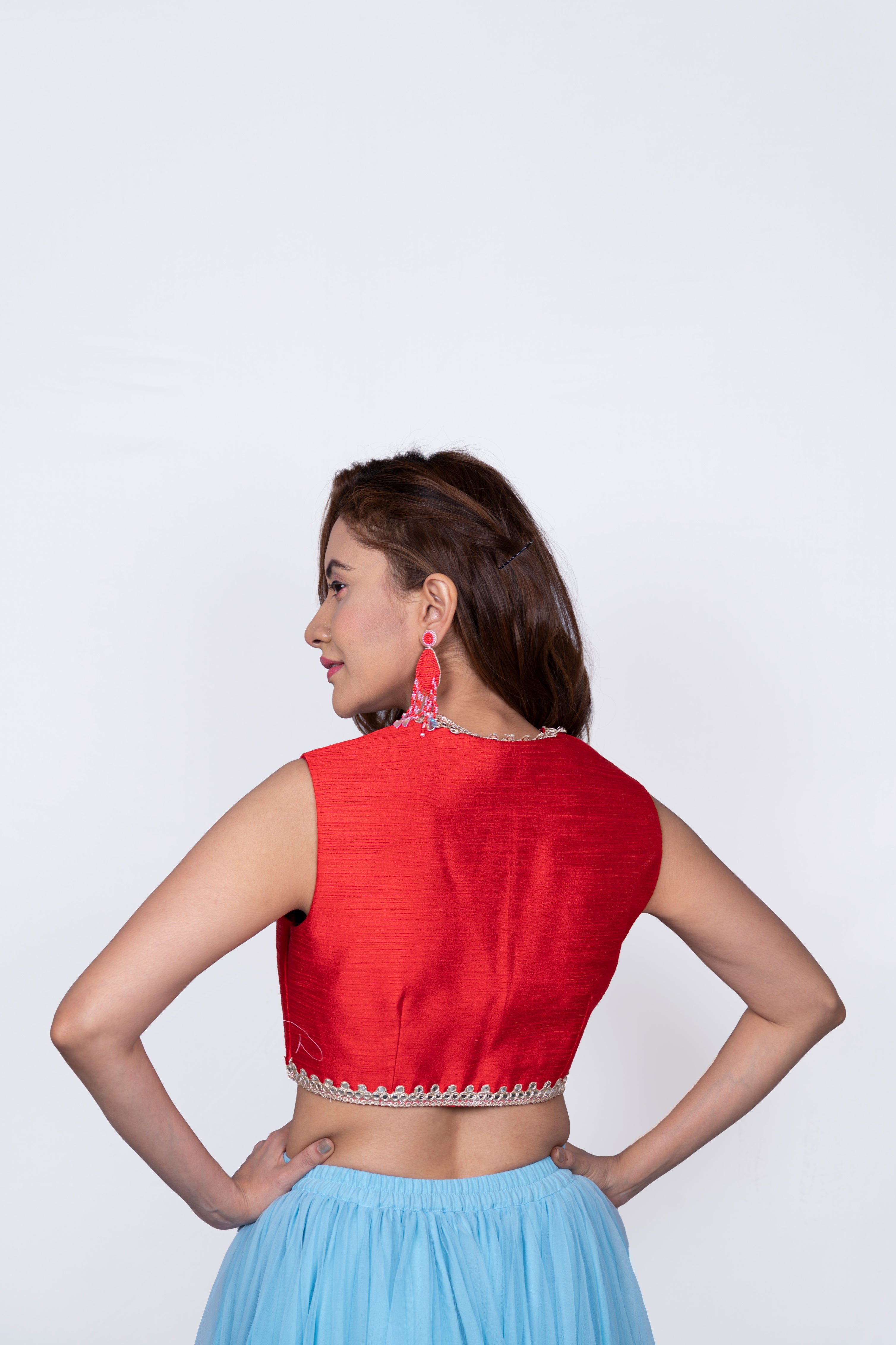 Red plunging neck blouse