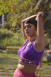Rani pink net lehenga with purple velvet blouse