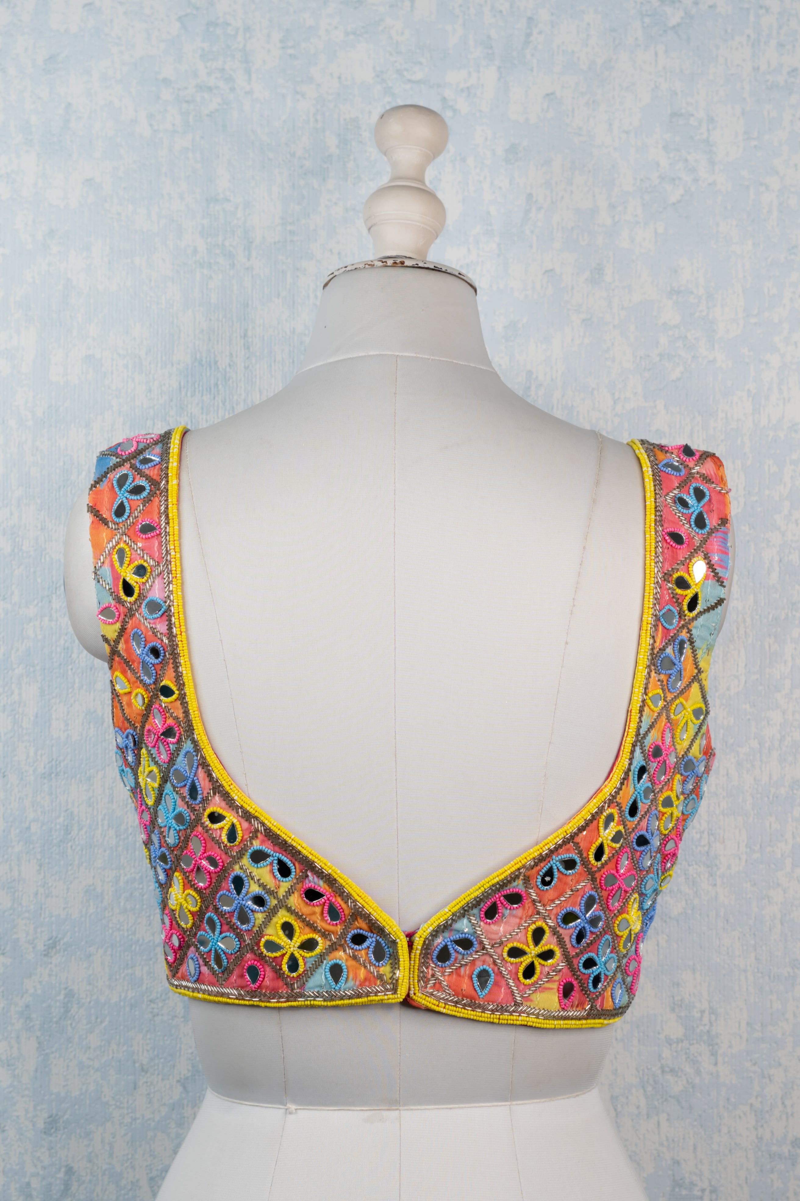 Multicolor mirror hand embroidered blouse.