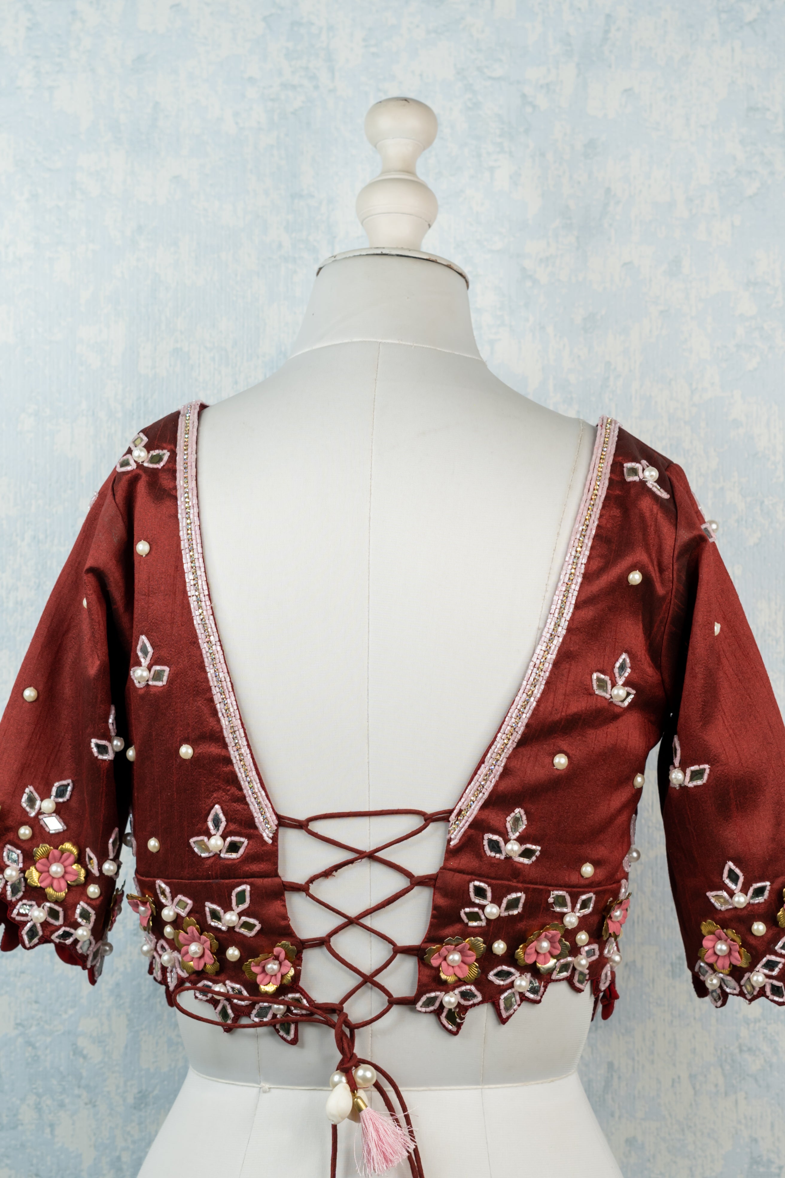 Maroon hand embroidered blouse.