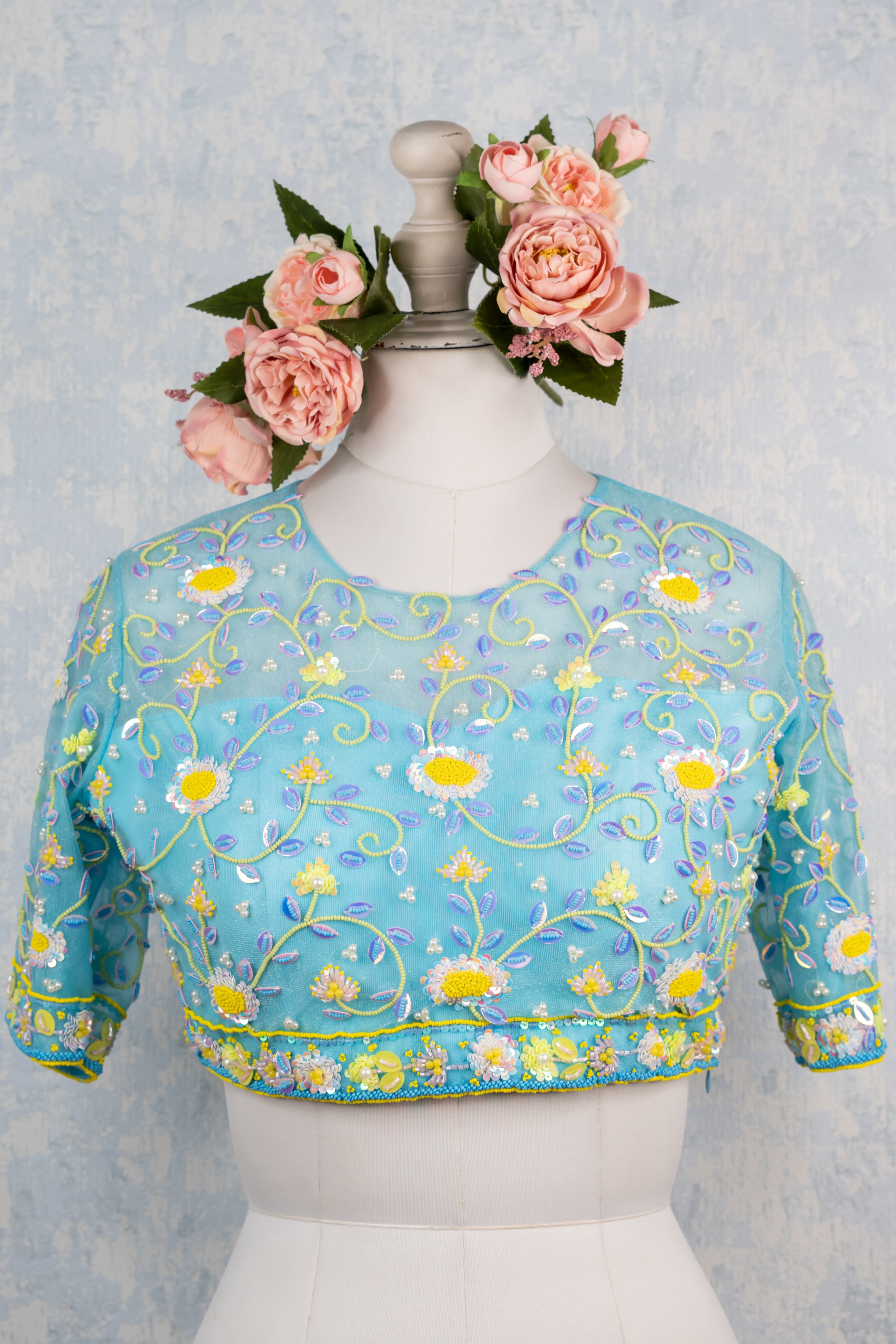 Blue hand embroidered blouse.