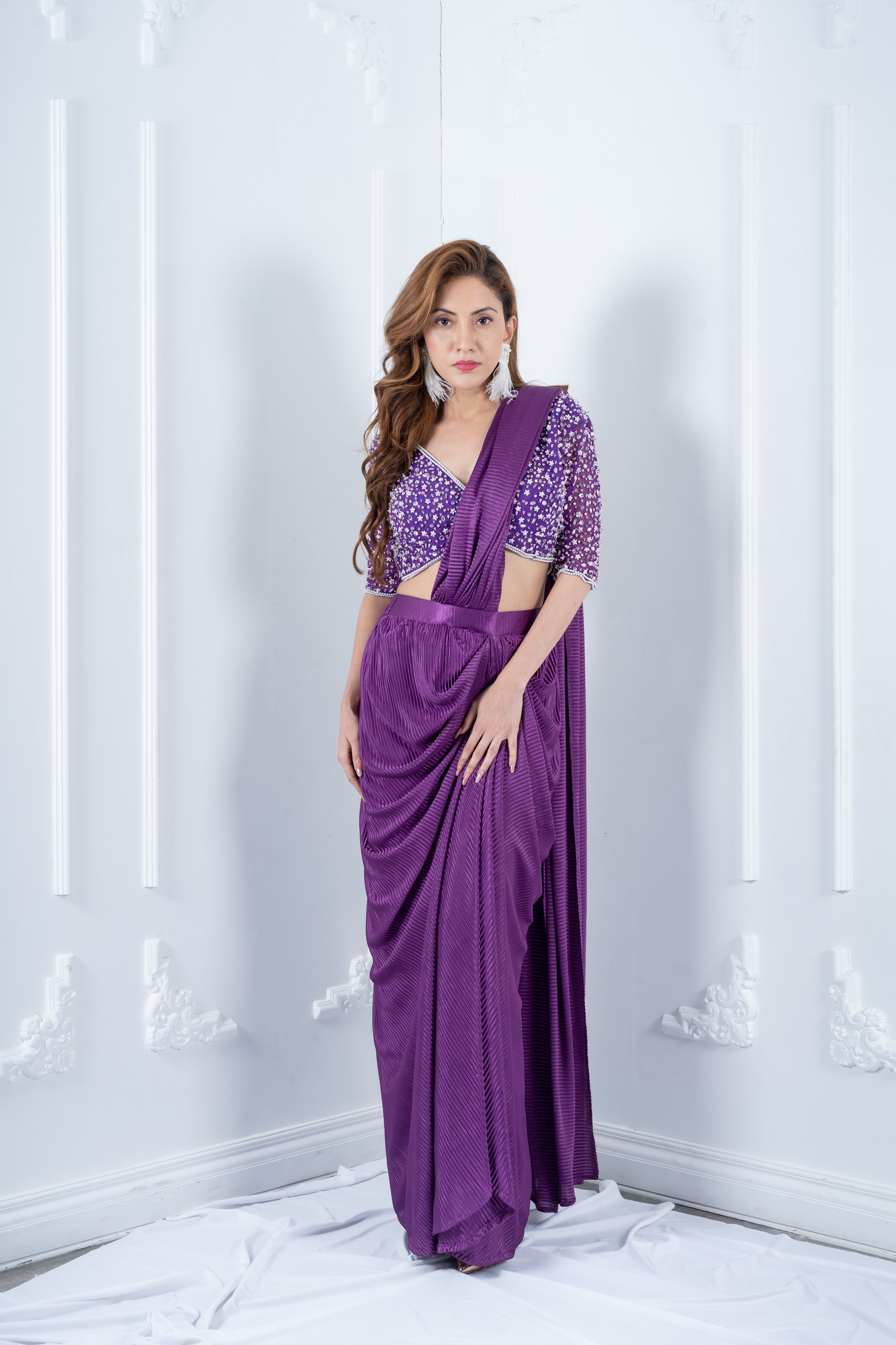 Purple hand embroidered blouse with pleated drape saree