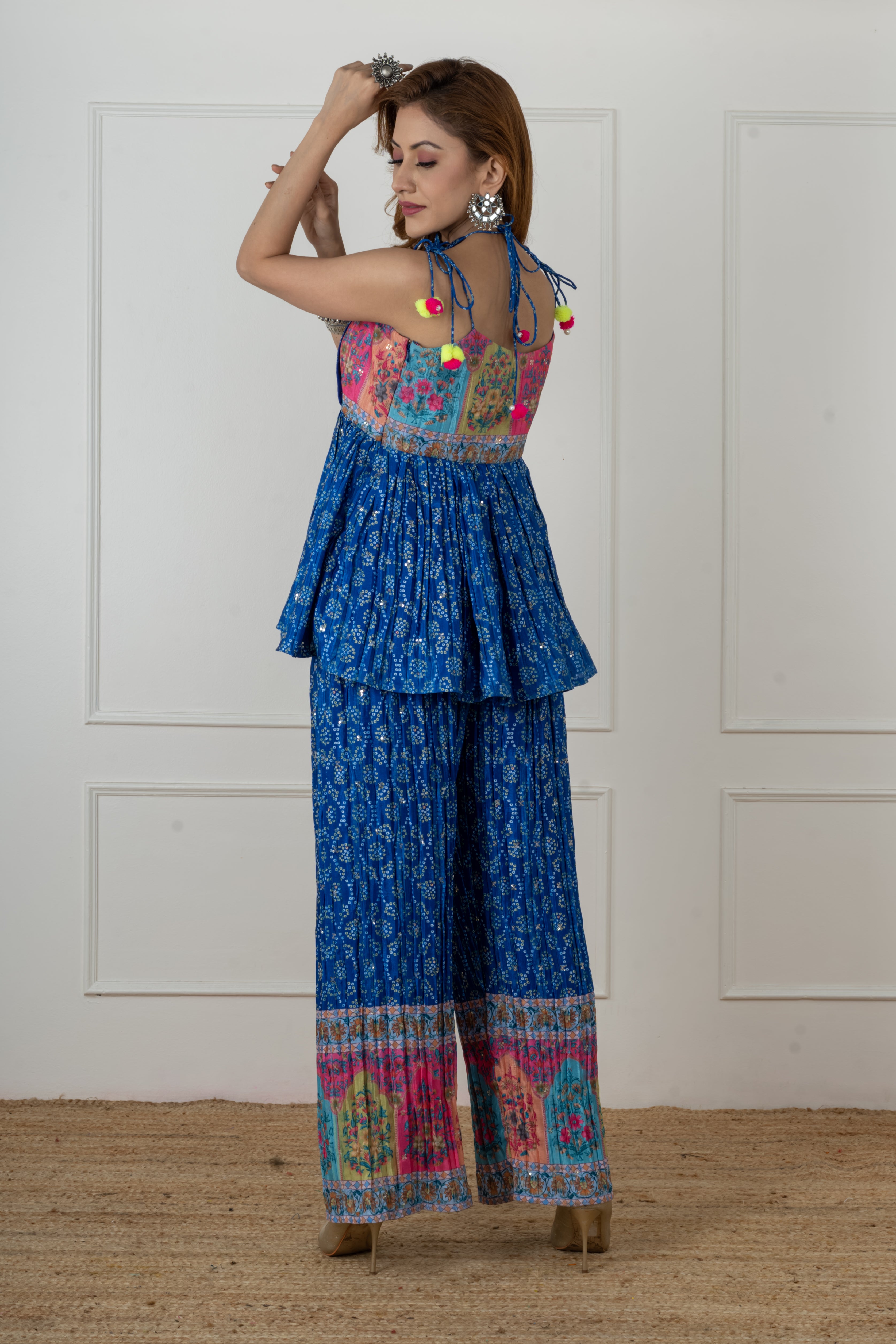 Back design of blue Bandhani kurta set featuring patchwork and tie-up detail, ideal for Navratri or special occasions.