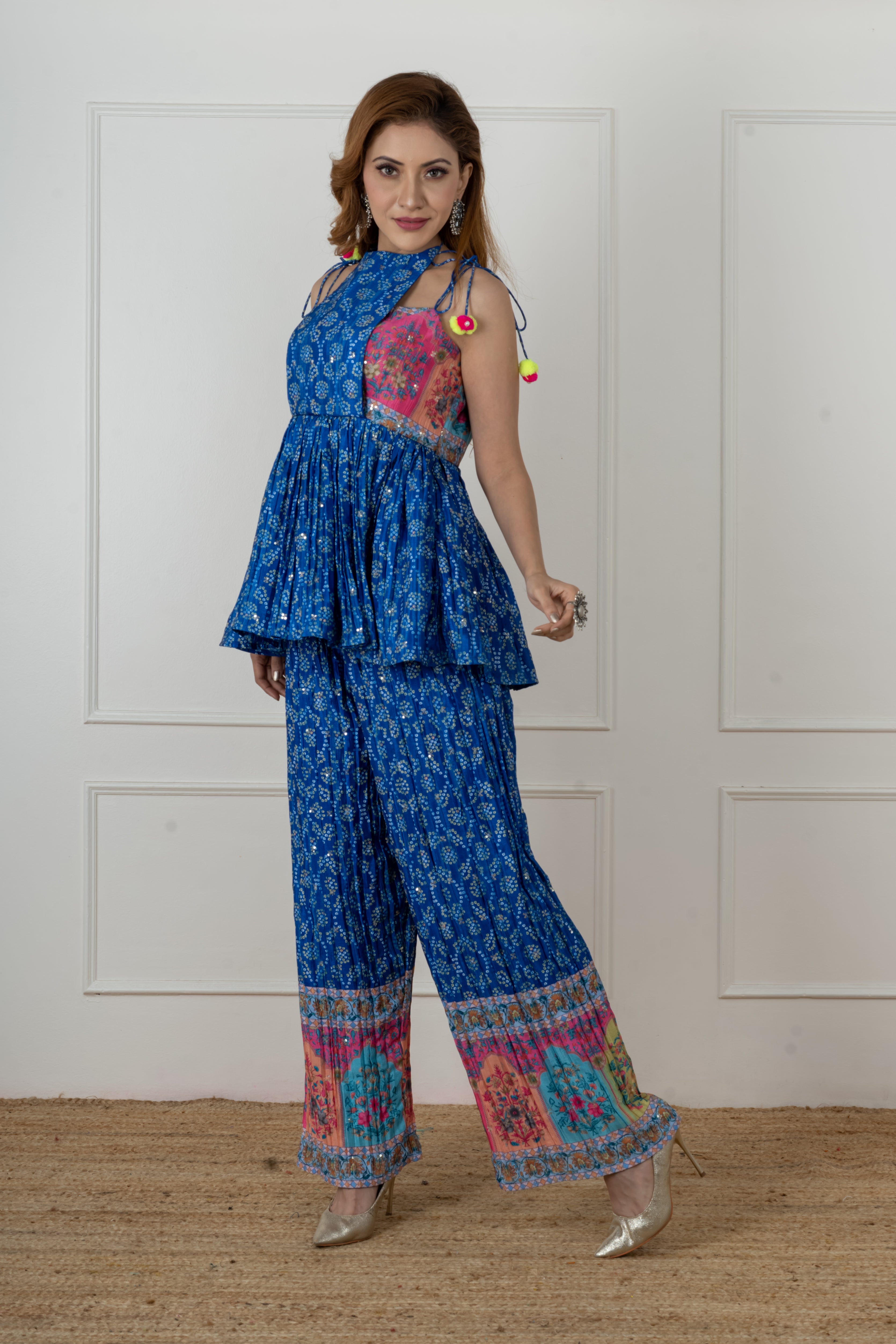 Model wearing designer blue Bandhani kurti set with palazzo, styled for Raksha Bandhan and Navratri festivals.