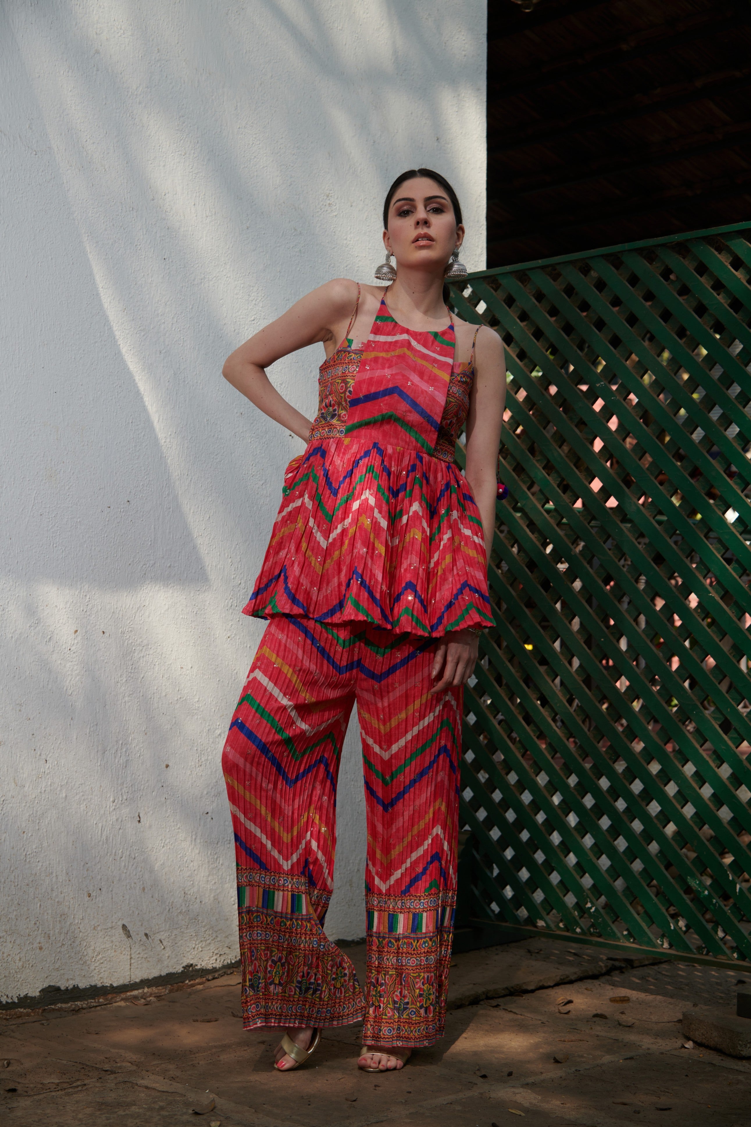 Sleeveless kurta set styled as resort wear, combining comfort with luxury vacation-ready fashion.