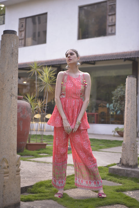 Full-length view of orange sleeveless kurta palazzo set with floral print design